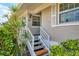 Home entrance with well-manicured landscaping and a clearly marked address at 623 Estuary Dr, Bradenton, FL 34209