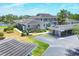 Exterior view of property with covered parking, landscaping, and second floor balcony at 623 Estuary Dr, Bradenton, FL 34209