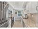 Modern kitchen featuring stainless steel appliances and granite countertops at 623 Estuary Dr, Bradenton, FL 34209