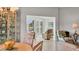 The dining room opens to the bright living room with a view of the lake at 623 Estuary Dr, Bradenton, FL 34209