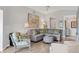 Comfortable living room with hardwood floors, modern decor, and lots of seating at 623 Estuary Dr, Bradenton, FL 34209