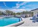 Inviting pool area with lounge chairs and a well-maintained deck, perfect for relaxation and recreation at 623 Estuary Dr, Bradenton, FL 34209