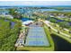 Aerial view of pristine community tennis courts and lush landscaping offers a resort-style experience at 623 Estuary Dr, Bradenton, FL 34209