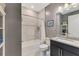 Well-lit bathroom with granite countertop, neutral walls, and tiled bathtub-shower combo at 6252 Winding Pine Dr, Nokomis, FL 34275