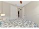 Bedroom featuring overhead fan, neutral paint and conveniently located doors at 6252 Winding Pine Dr, Nokomis, FL 34275