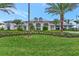 View of the community center showing manicured lawn, professional landscaping, and great curb appeal at 6252 Winding Pine Dr, Nokomis, FL 34275