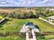 Aerial view of dog park featuring a gazebo and plenty of space for the dogs to roam at 6252 Winding Pine Dr, Nokomis, FL 34275