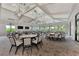 Expansive event room featuring high ceilings, ample seating, and modern lighting at 6252 Winding Pine Dr, Nokomis, FL 34275
