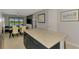 Open-concept kitchen and dining area with an island and seamless flow to living space at 6252 Winding Pine Dr, Nokomis, FL 34275