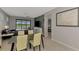 Comfortable living room next to dining area with view of pool and lake at 6252 Winding Pine Dr, Nokomis, FL 34275