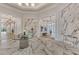 An interior view of the elegant lobby showcasing marble flooring and modern decor at 6252 Winding Pine Dr, Nokomis, FL 34275