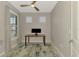 Bright office space with neutral walls, light-colored carpet, and a ceiling fan at 6252 Winding Pine Dr, Nokomis, FL 34275