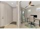 Bright office space with a ceiling fan, natural light, and modern desk setup at 6252 Winding Pine Dr, Nokomis, FL 34275