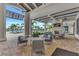 Inviting outdoor lounge with comfortable seating and a fireplace, overlooking the pool area at 6252 Winding Pine Dr, Nokomis, FL 34275