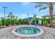 Spa includes a lift for individuals with mobility challenges and is surrounded by lush landscaping at 6252 Winding Pine Dr, Nokomis, FL 34275