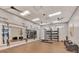 Functional workout area with weights, mirror, and suspension training equipment for versatile fitness routines at 6252 Winding Pine Dr, Nokomis, FL 34275