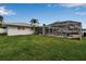 A spacious backyard features a screened-in pool, perfect for outdoor entertaining at 6422 Beechwood Ave, Sarasota, FL 34231