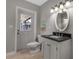 Bathroom with vanity and direct access to the backyard; convenient for outdoor activities at 6422 Beechwood Ave, Sarasota, FL 34231