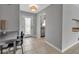 View of the home's bright entryway leading to the kitchen with stainless steel appliances at 6422 Beechwood Ave, Sarasota, FL 34231