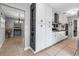 Open kitchen featuring white cabinets, stainless steel appliances and granite countertops at 6422 Beechwood Ave, Sarasota, FL 34231