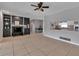 Open concept living area showcasing a fireplace, breakfast bar, and tiled flooring at 6422 Beechwood Ave, Sarasota, FL 34231
