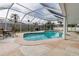 Enclosed pool for exercise and leisure offers ample lounge space, providing a luxurious outdoor experience at 6422 Beechwood Ave, Sarasota, FL 34231