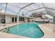 Enclosed pool featuring a large deck area perfect for outdoor lounging and entertaining by the water at 6422 Beechwood Ave, Sarasota, FL 34231