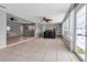 Bright sunroom with tile flooring, wet bar, and ample natural light, leading to the pool area at 6422 Beechwood Ave, Sarasota, FL 34231