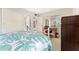 Bright bedroom with a full bed, desk, and ensuite bathroom for added convenience at 6460 Mourning Dove Dr # 102, Bradenton, FL 34210