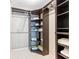 Organized walk-in closet with shelving and hanging rods for efficient storage and space utilization at 6460 Mourning Dove Dr # 102, Bradenton, FL 34210