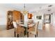 Dining area with modern lighting, a glass table, and cabinetry for storage at 6460 Mourning Dove Dr # 102, Bradenton, FL 34210
