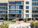 Waterfront condo building featuring multiple floors with individual balconies and gorgeous views at 6460 Mourning Dove Dr # 102, Bradenton, FL 34210