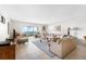 Bright living room with tile floors, comfortable seating, and expansive views of the ocean at 6460 Mourning Dove Dr # 102, Bradenton, FL 34210