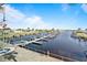 A full marina with many boats docked and waterfront homes at 649 Fairmount Dr, North Port, FL 34287