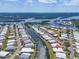 Waterfront community featuring boat canals, residences, and the Gulf of Mexico in the background at 649 Fairmount Dr, North Port, FL 34287
