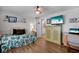 Bright bedroom with wood flooring and a television on the wall at 649 Fairmount Dr, North Port, FL 34287
