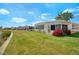 The house has a well-maintained lawn, and exterior features make it inviting at 649 Fairmount Dr, North Port, FL 34287