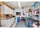 The garage is outfitted with white cabinets, countertops, and an overhead work light at 649 Fairmount Dr, North Port, FL 34287