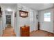 Hallway with wood flooring, white walls and doors, and decorative furniture at 649 Fairmount Dr, North Port, FL 34287