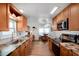 This kitchen features beautiful wood cabinets, stainless steel appliances, and a cozy eat-in dining area at 649 Fairmount Dr, North Port, FL 34287