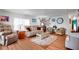 Inviting living room featuring hardwood flooring, neutral decor, and ample natural light at 649 Fairmount Dr, North Port, FL 34287