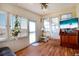 Bright sunroom with a water view and a TV at 649 Fairmount Dr, North Port, FL 34287