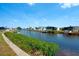 Waterfront view of houses with boat docks along a canal at 649 Fairmount Dr, North Port, FL 34287