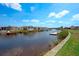 Picturesque waterfront view of a home with a private dock with direct water access at 649 Fairmount Dr, North Port, FL 34287