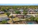 Drone shot showcasing the property, fenced backyard, and mature trees in the neighborhood at 6547 Samoa Dr, Sarasota, FL 34241