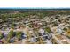 An aerial view showing a home's location in a residential area with mature trees and nearby amenities at 6547 Samoa Dr, Sarasota, FL 34241