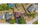Bird's eye view of a home with a spacious backyard, surrounded by trees and a neighboring pool at 6547 Samoa Dr, Sarasota, FL 34241