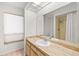 Bathroom with a single vanity, a large mirror, and a shower with a curtain at 6547 Samoa Dr, Sarasota, FL 34241