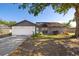 Charming single-story home with a well-manicured lawn and attached two-car garage at 6547 Samoa Dr, Sarasota, FL 34241