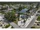 Stunning aerial view of a beautiful home with a private pool and waterfront views of a serene lake at 6924 34Th W Ave, Bradenton, FL 34209